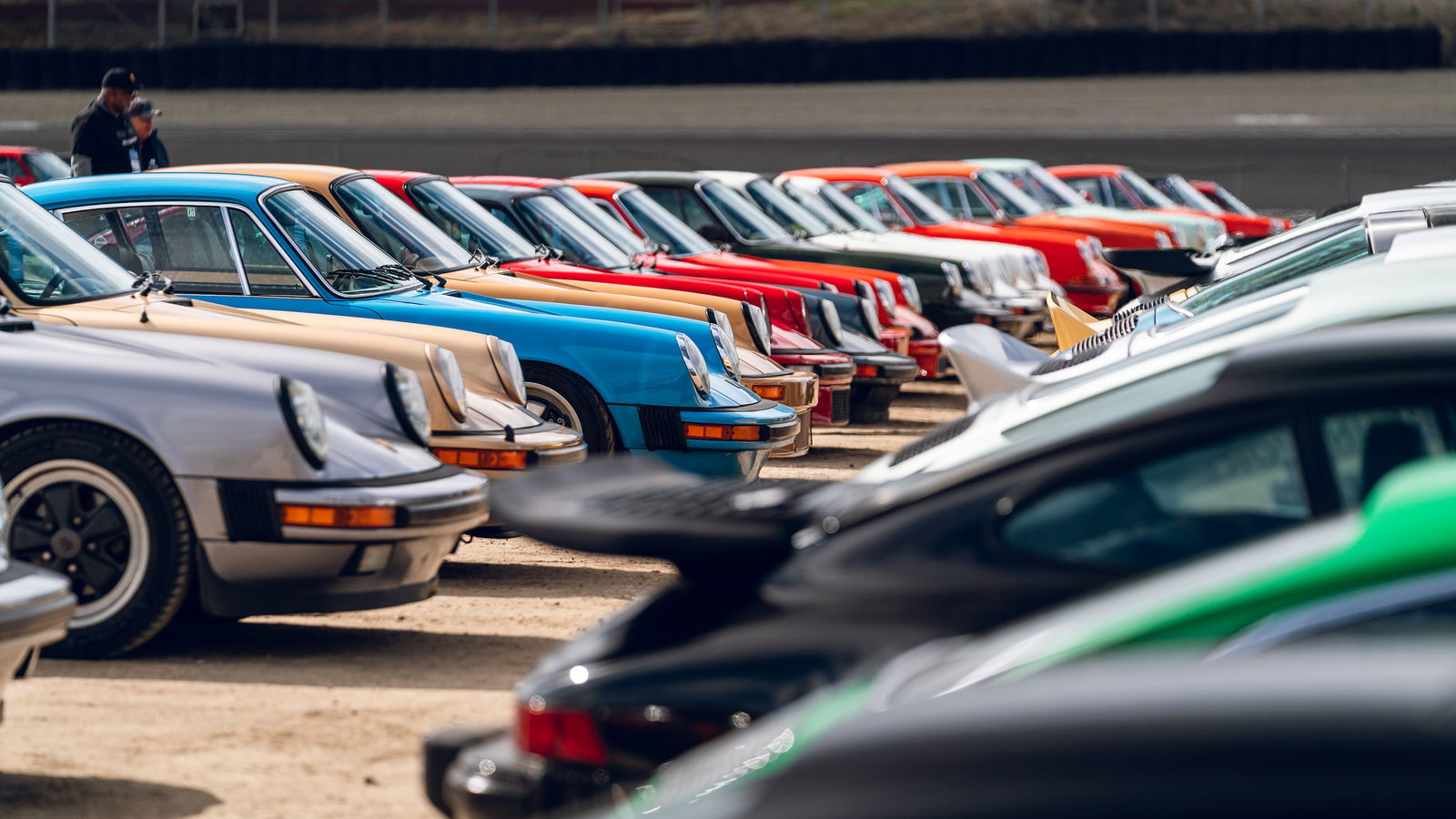 Several rows of air-cooled Porsche 911s at Rennsport Reunion 7